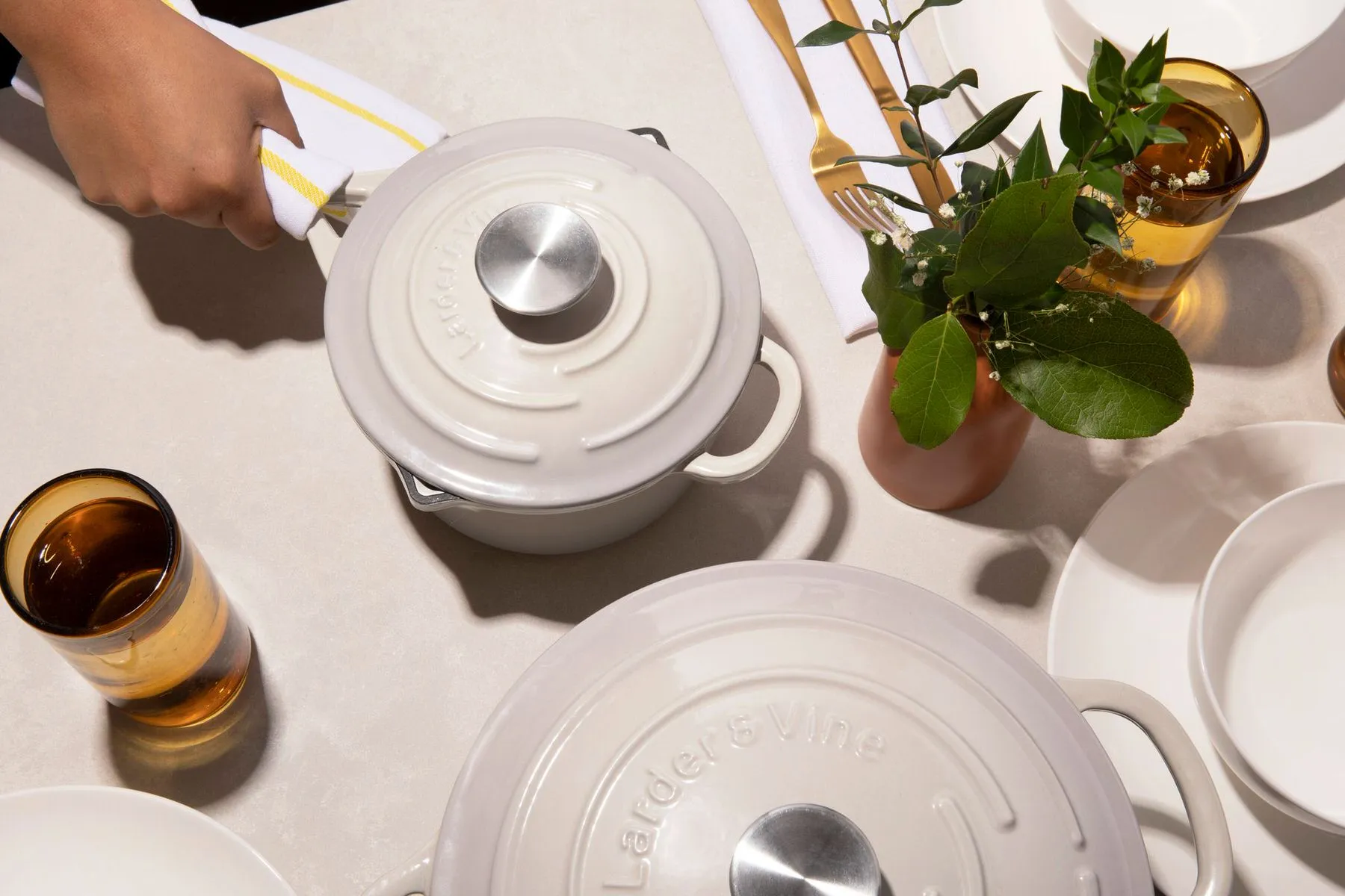 a kitchen table with cookware 